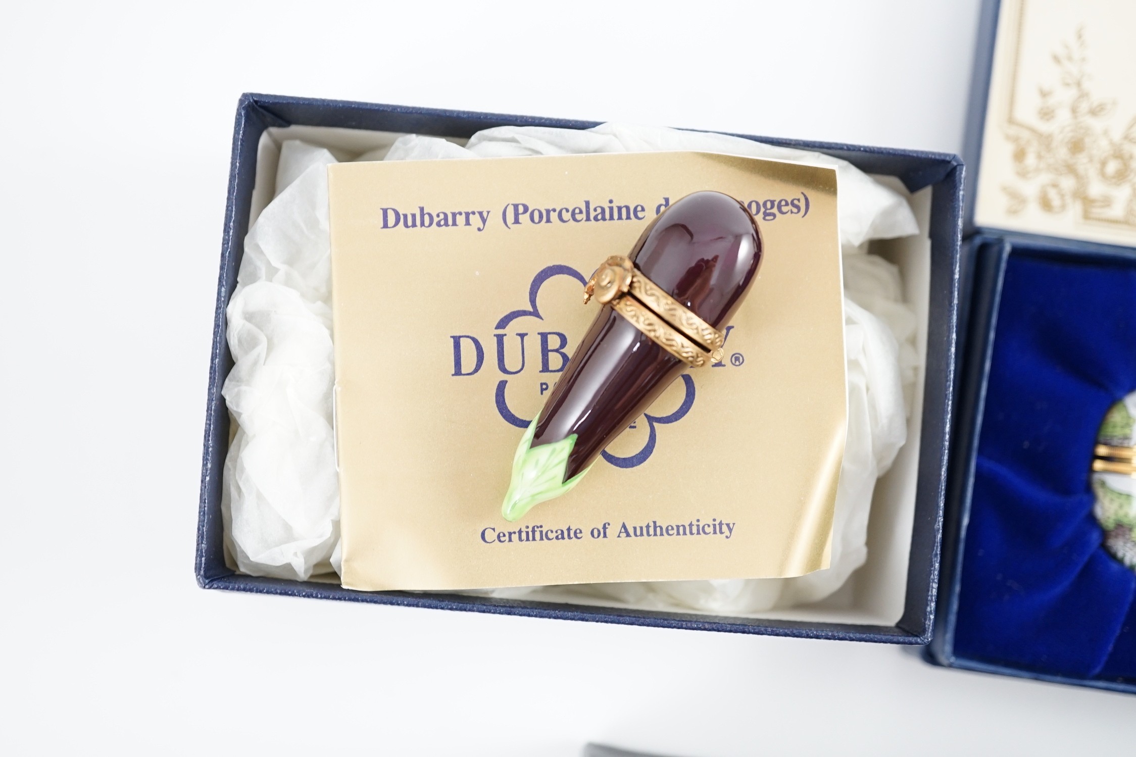 Two Halcyon Days enamel boxes; frog and 1991, two Dubarry boxes and a white metal model elephant, all boxed.